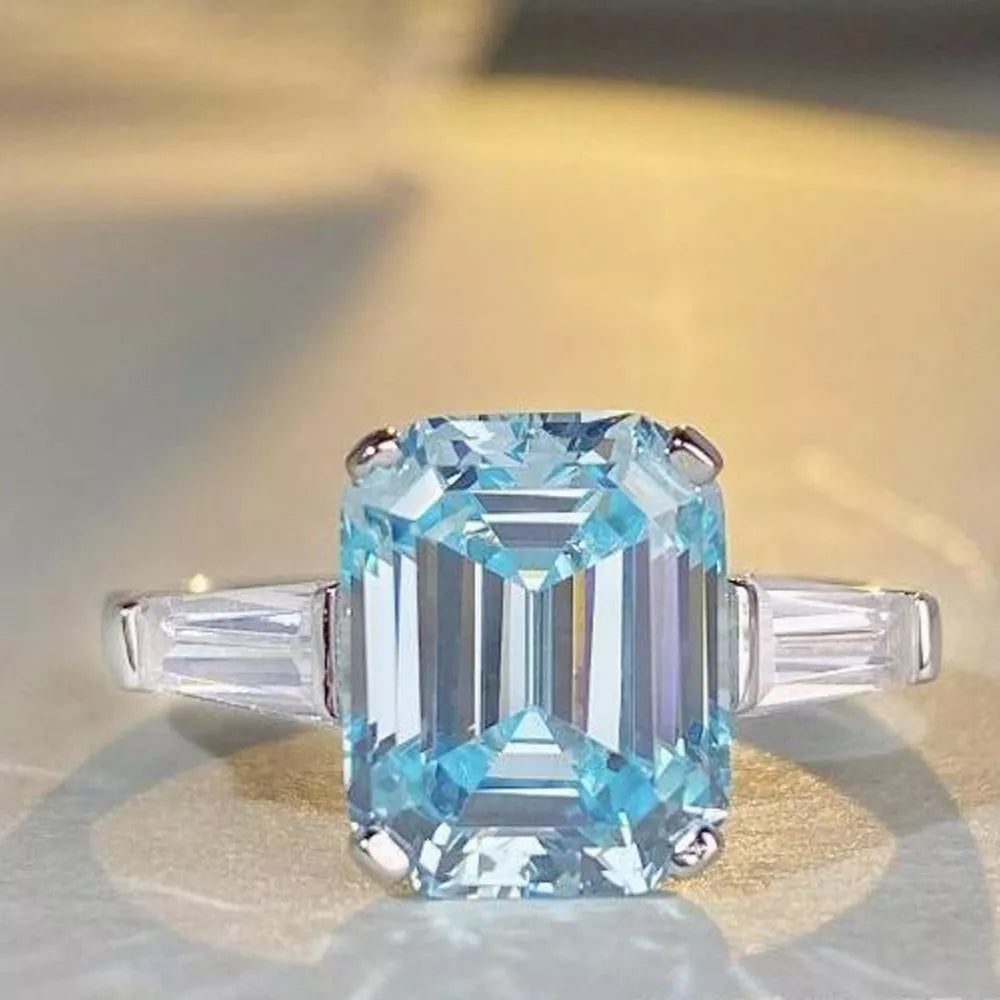 silver ring featuring zircon stone and geometric