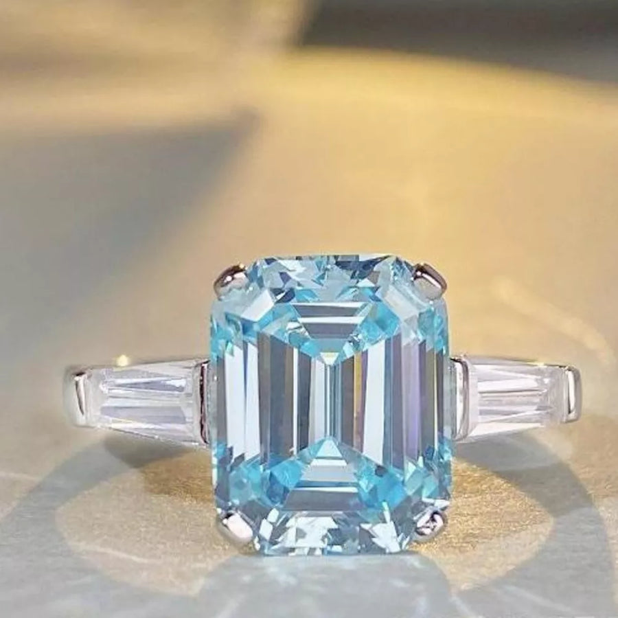 silver ring featuring zircon stone and geometric