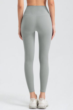 Sculpted seam high-waist performance leggings in Khaki with a V-cut back detail.
