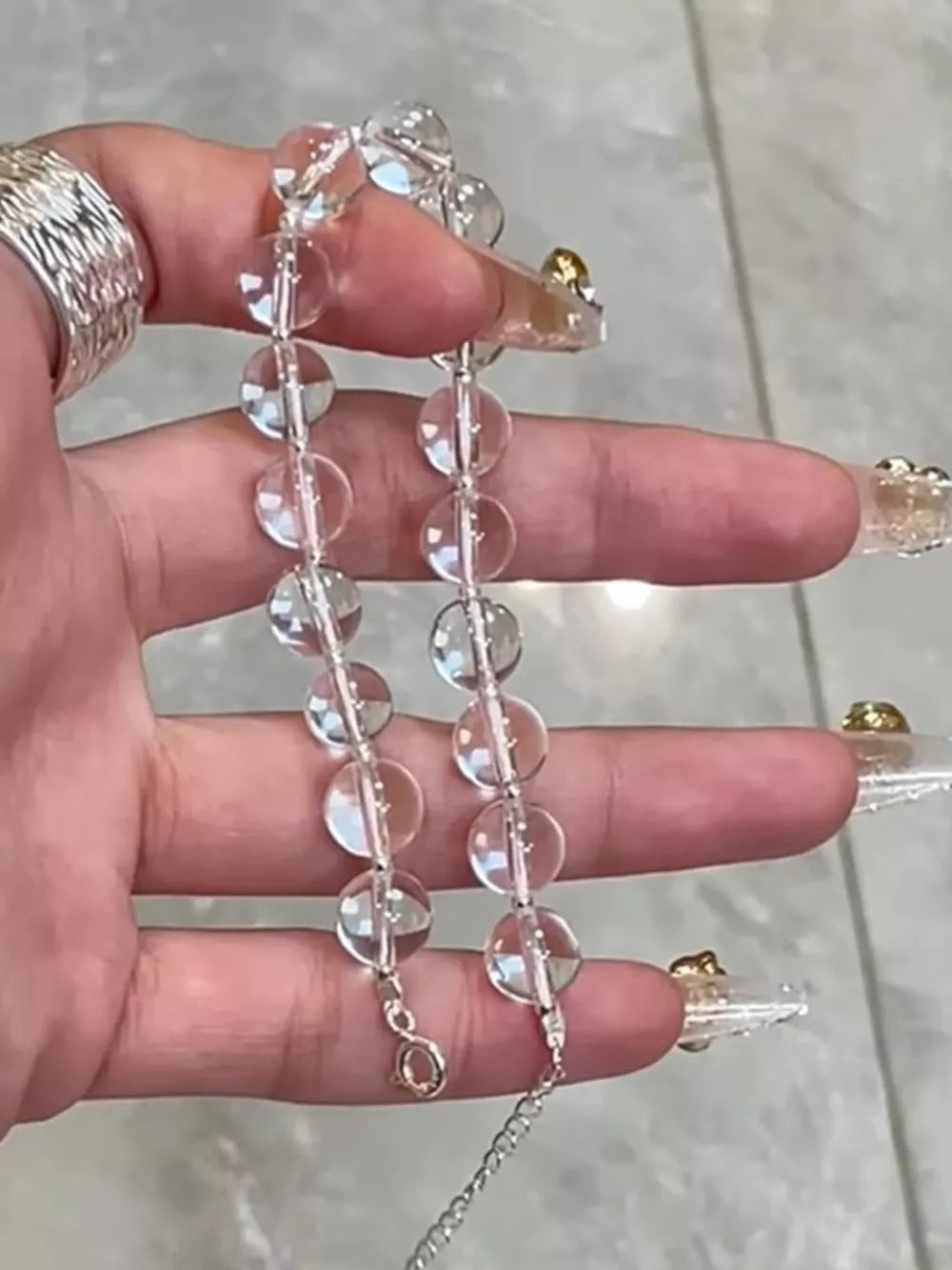 Radiant Crystal Bead Silver Bracelet with adjustable chain and lobster clasp.