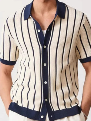 Textured knit polo shirt in navy and cream vertical stripes with contrast trim.