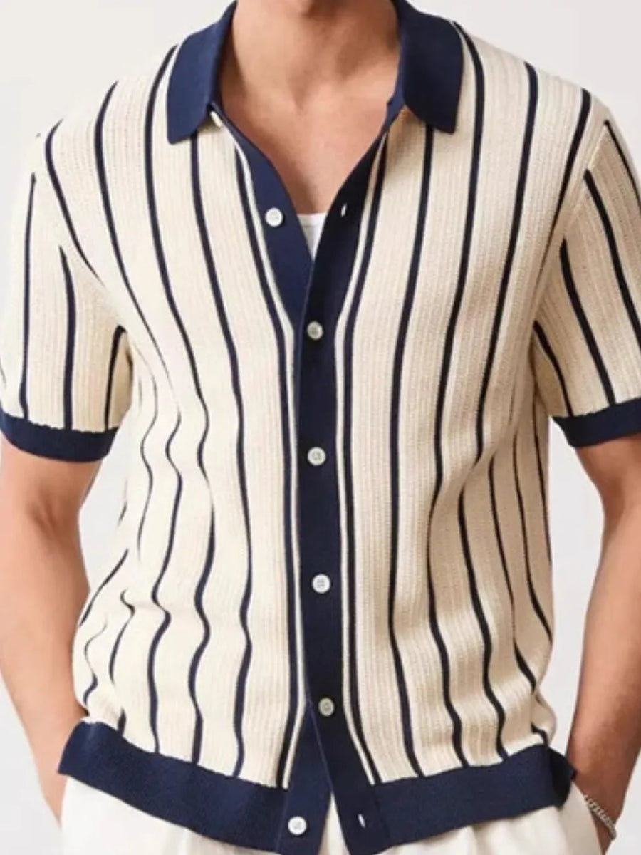 Textured knit polo shirt in navy and cream vertical stripes with contrast trim.