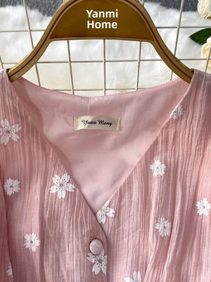 Dusty Pink embroidered midi dress with V-neck and button detail.