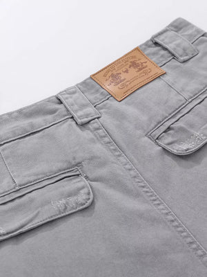 Grey cargo capris with distressed pocket details and a leather brand patch.