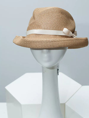 Beige straw sun hat with white ribbon detail and bow