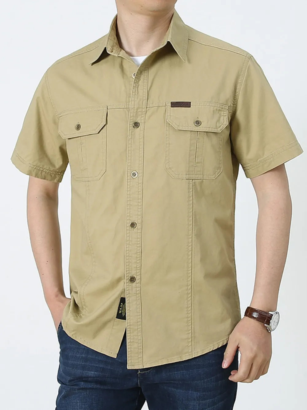 Men's khaki short sleeve cotton shirt with buttoned chest pockets and a leather patch detail.