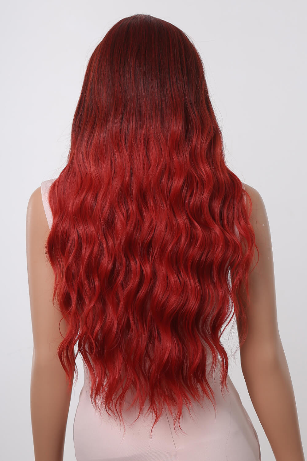 Crimson ombre synthetic wave wig with loose curls cascading down the back.