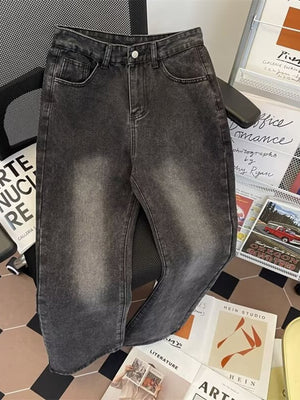 Dark wash faded denim jeans with a straight leg
