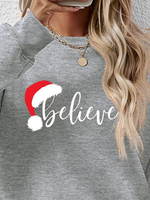 Gray raglan sweatshirt with white "Believe" text and Santa hat graphic
