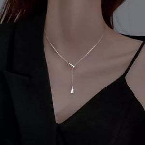 Sterling silver Y necklace with two triangular charms, one dangling.