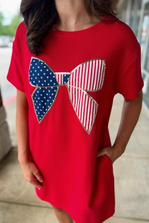 Red cotton mini dress with a sequined stars and stripes bow applique.