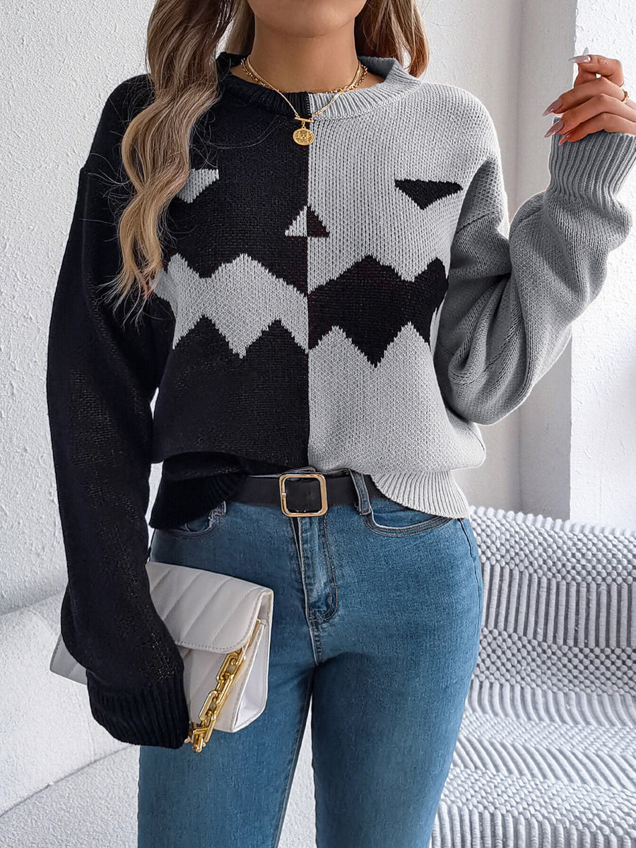 black pullover sweater with ribbed cuffs and long sleeve