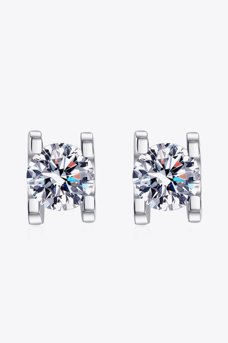 Silver moissanite stud earrings with sculpted settings.