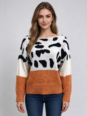 95% polyester, 5% spandex Care instructions: Machine wash cold pullover sweater in orange with relaxed silhouette