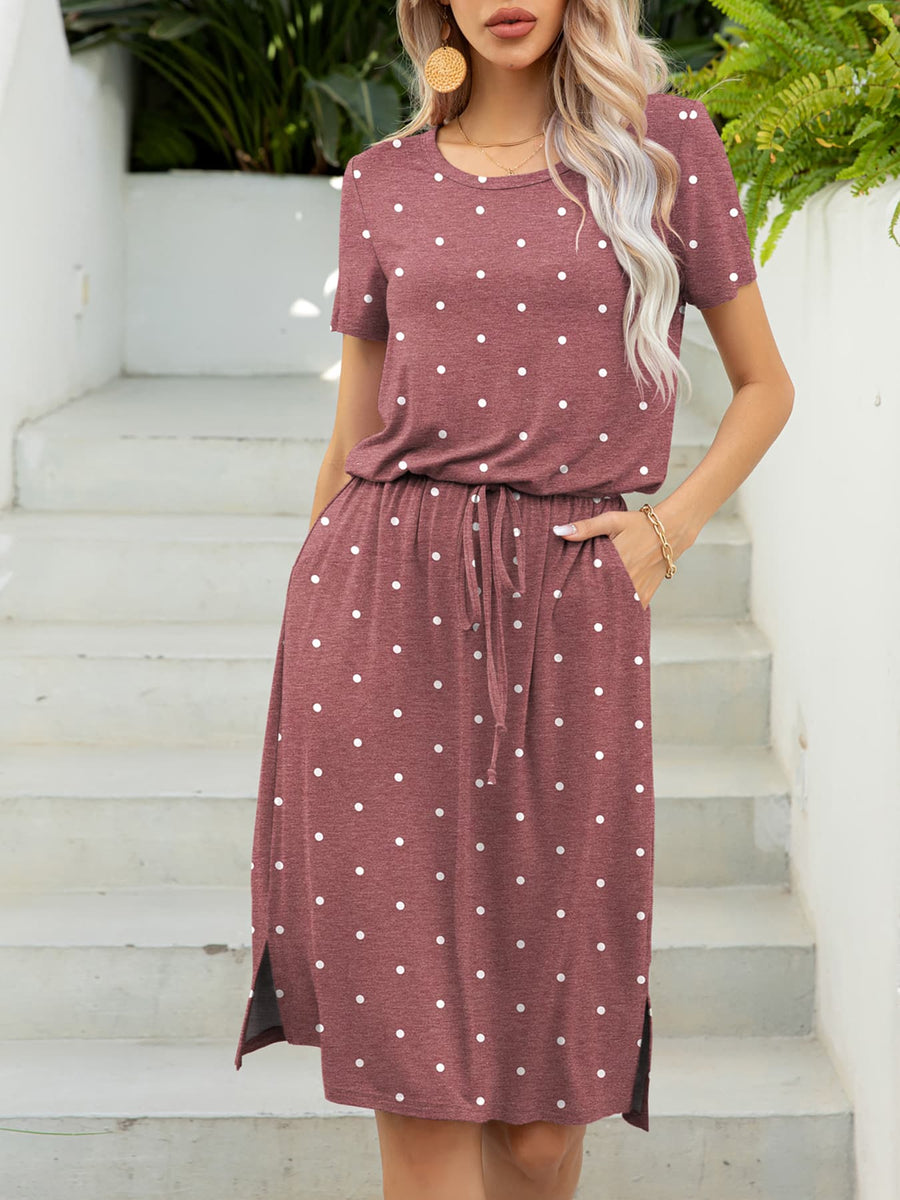 Drawstring waist midi dress in Moonlit Mauve with white polka dots, short sleeves, and side slits.