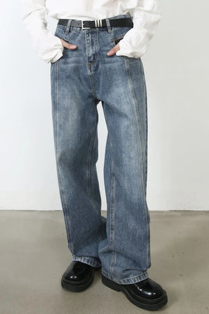 Panel seam denim trousers in medium wash with a relaxed fit.