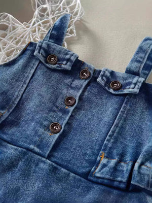 Adjustable denim overall dress for kids with button-down front and pocket details.