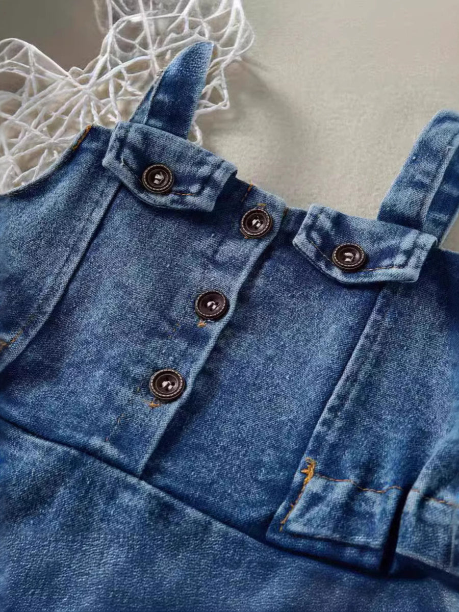 Adjustable denim overall dress for kids with button-down front and pocket details.