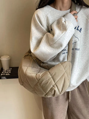 Quilted crossbody bag in khaki with diamond stitching and a relaxed fit.