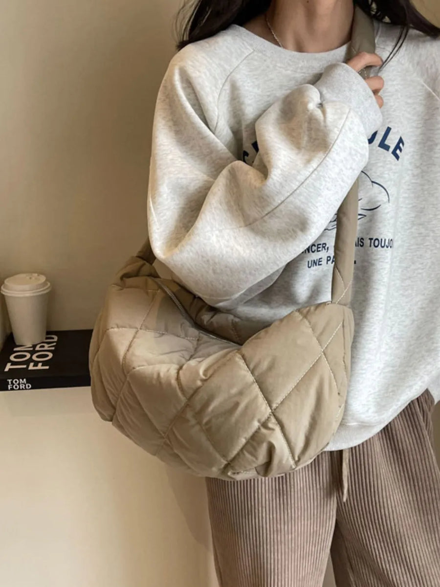 Quilted crossbody bag in khaki with diamond stitching and a relaxed fit.