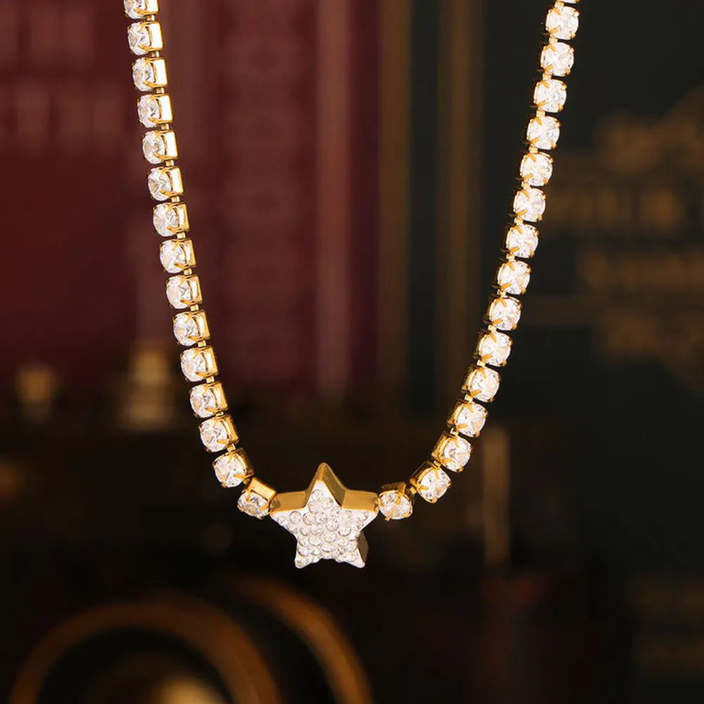 Gold celestial starburst pavé choker necklace with clear crystals.