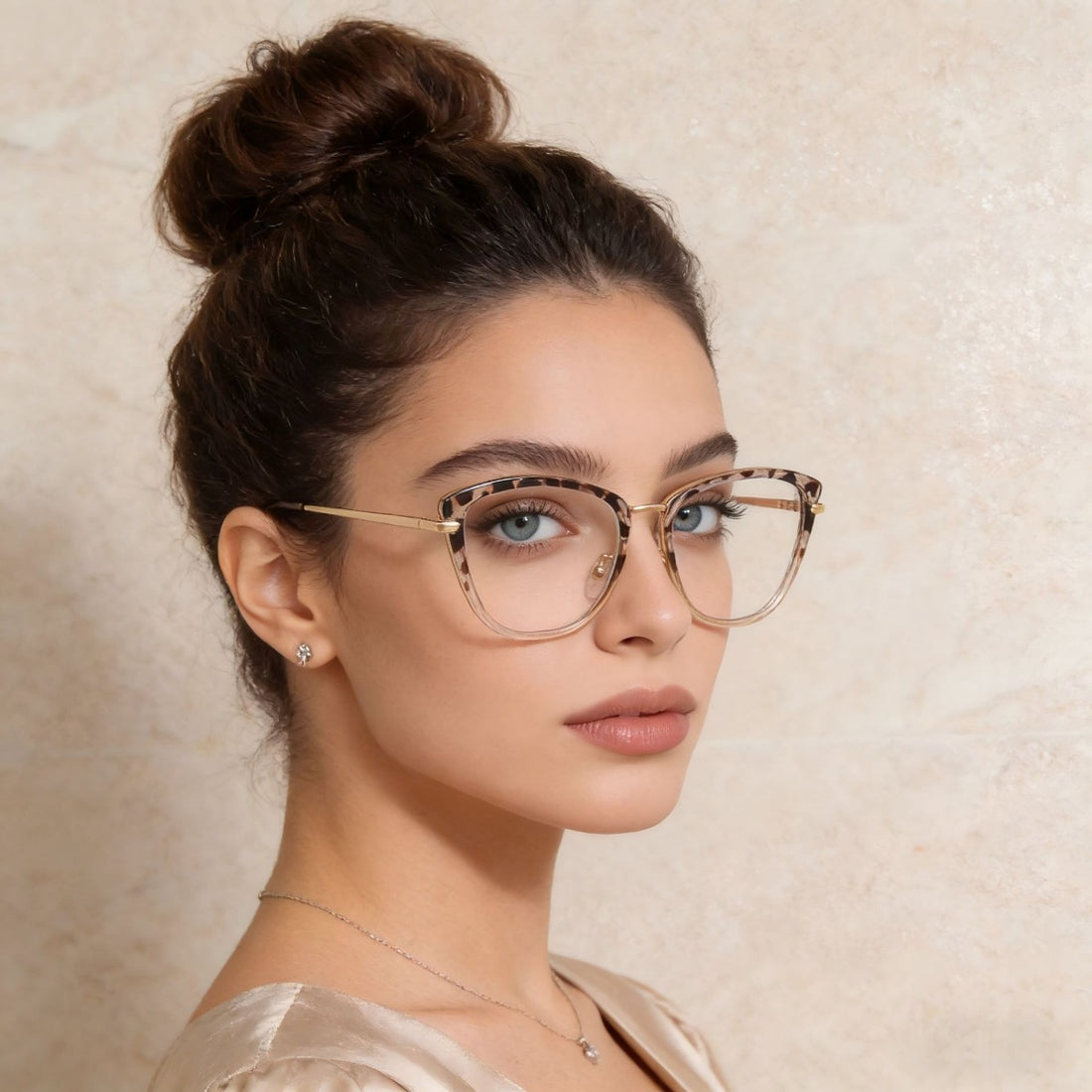 Cat-eye glasses with leopard print accents and gold metal details.