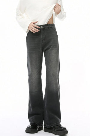 Dark wash wide leg jeans with a high rise and pockets.