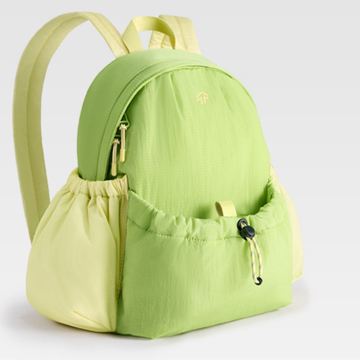 Mini lightweight nylon drawstring backpack in Gum Leaf green with yellow accents and side pockets.