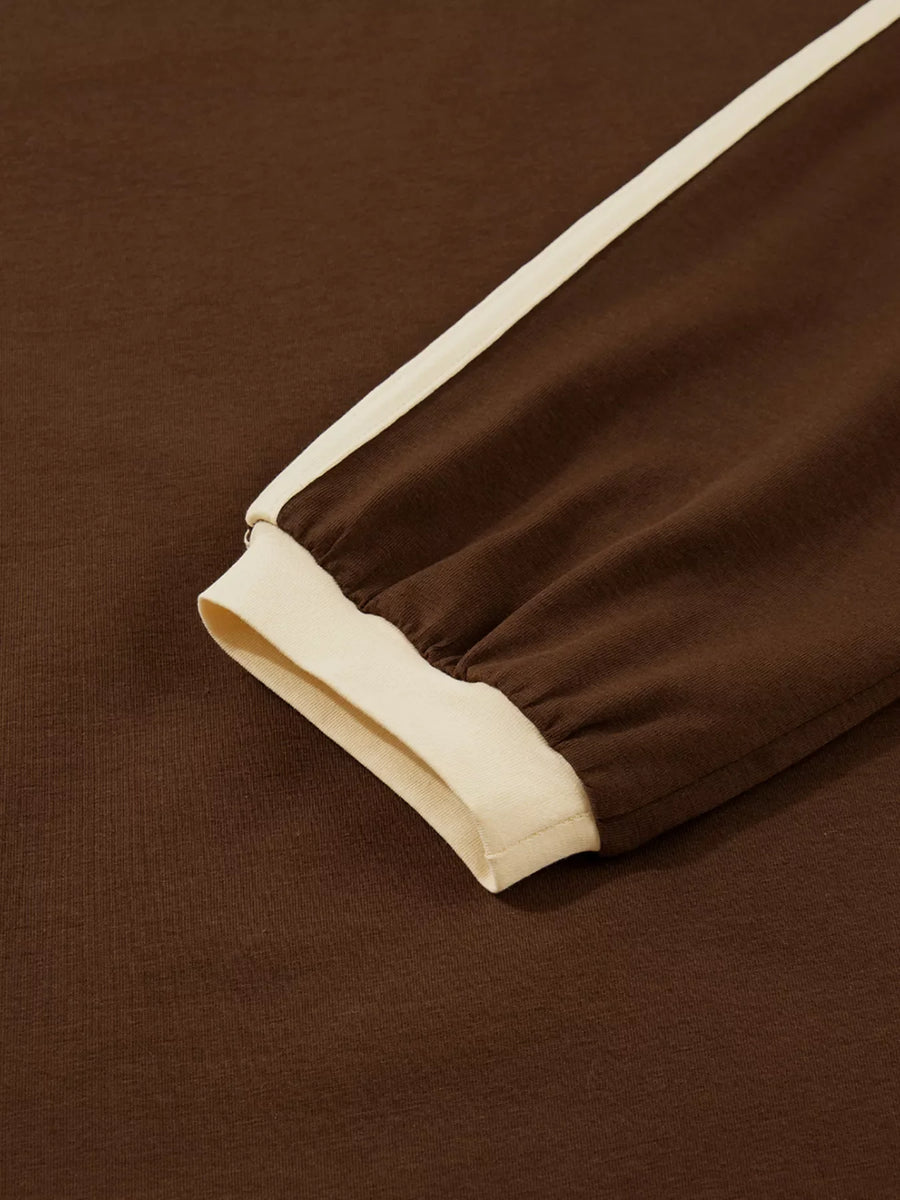 Dark brown long-sleeve t-shirt with cream contrast trim on sleeve and cuff