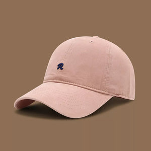 Pink baseball cap with embroidered blue R logo