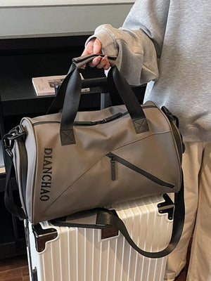 Spacious taupe Oxford travel bag with black trim and zipper details.