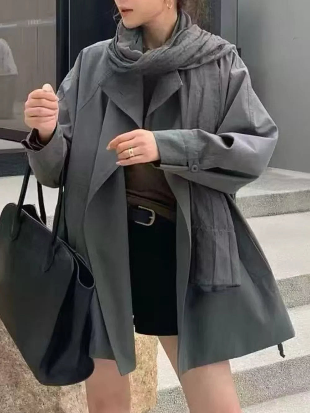 trench coat in charcoal featuring pocketed and relaxed fit