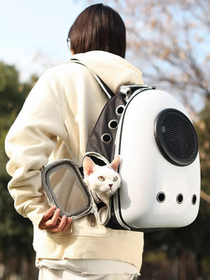 White and black pet carrier backpack with bubble window, a white cat peeking out.