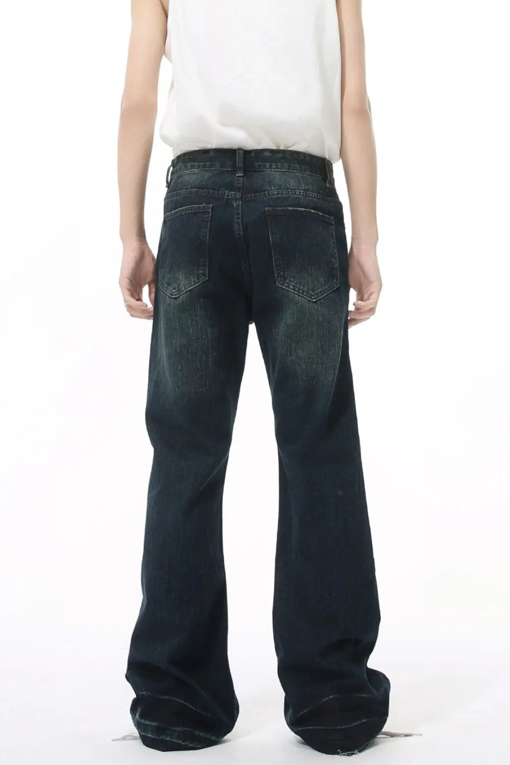 Dark wash flared jeans with vintage fading and a relaxed fit.