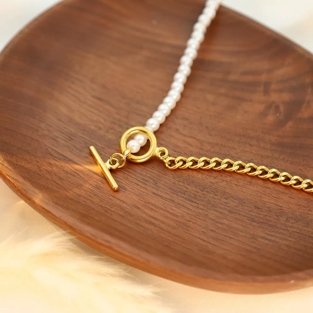 necklace in cream featuring toggle closure and straight fit