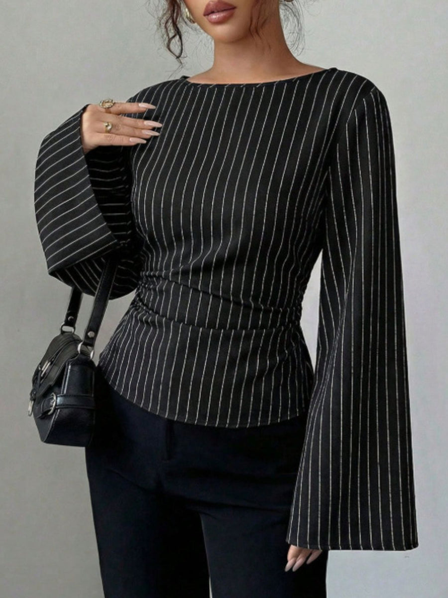 100% polyester Care instructions: Machine wash cold blouse in Black with fitted silhouette