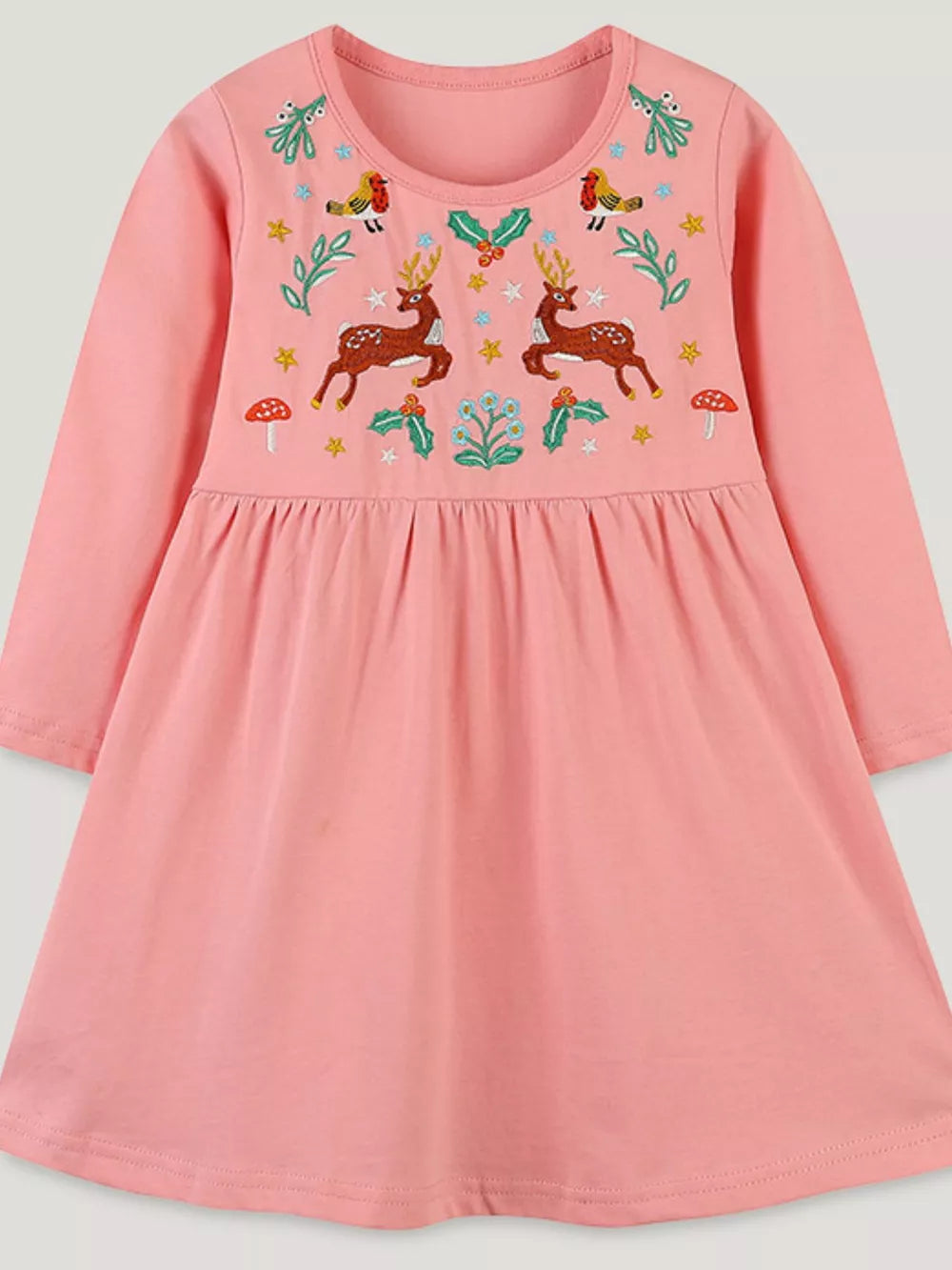 Pink cotton dress with embroidered deer, birds, holly, and mushrooms.