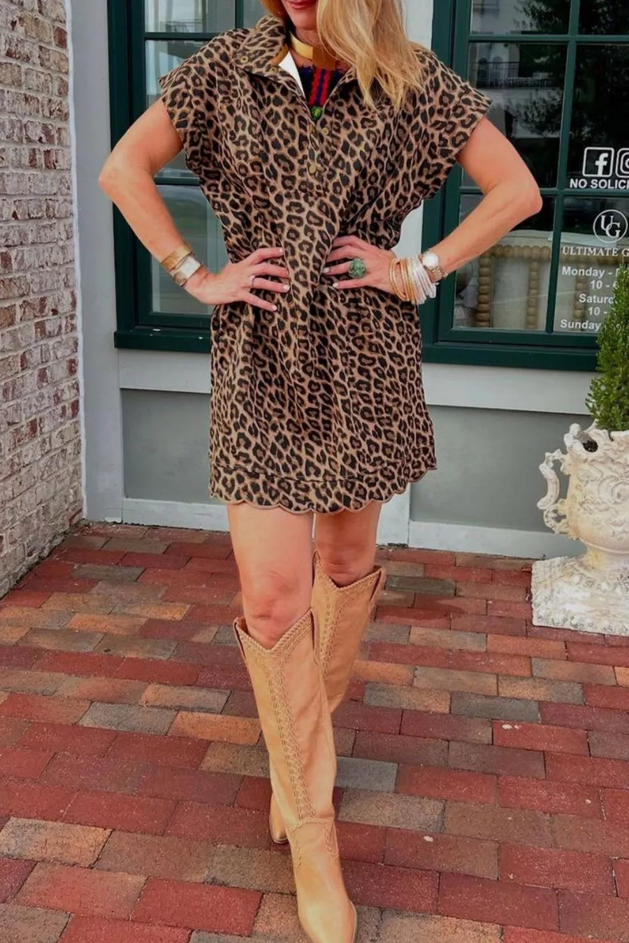 Leopard print collared shirt dress with short sleeves and scalloped hem, styled with tan cowboy boots.