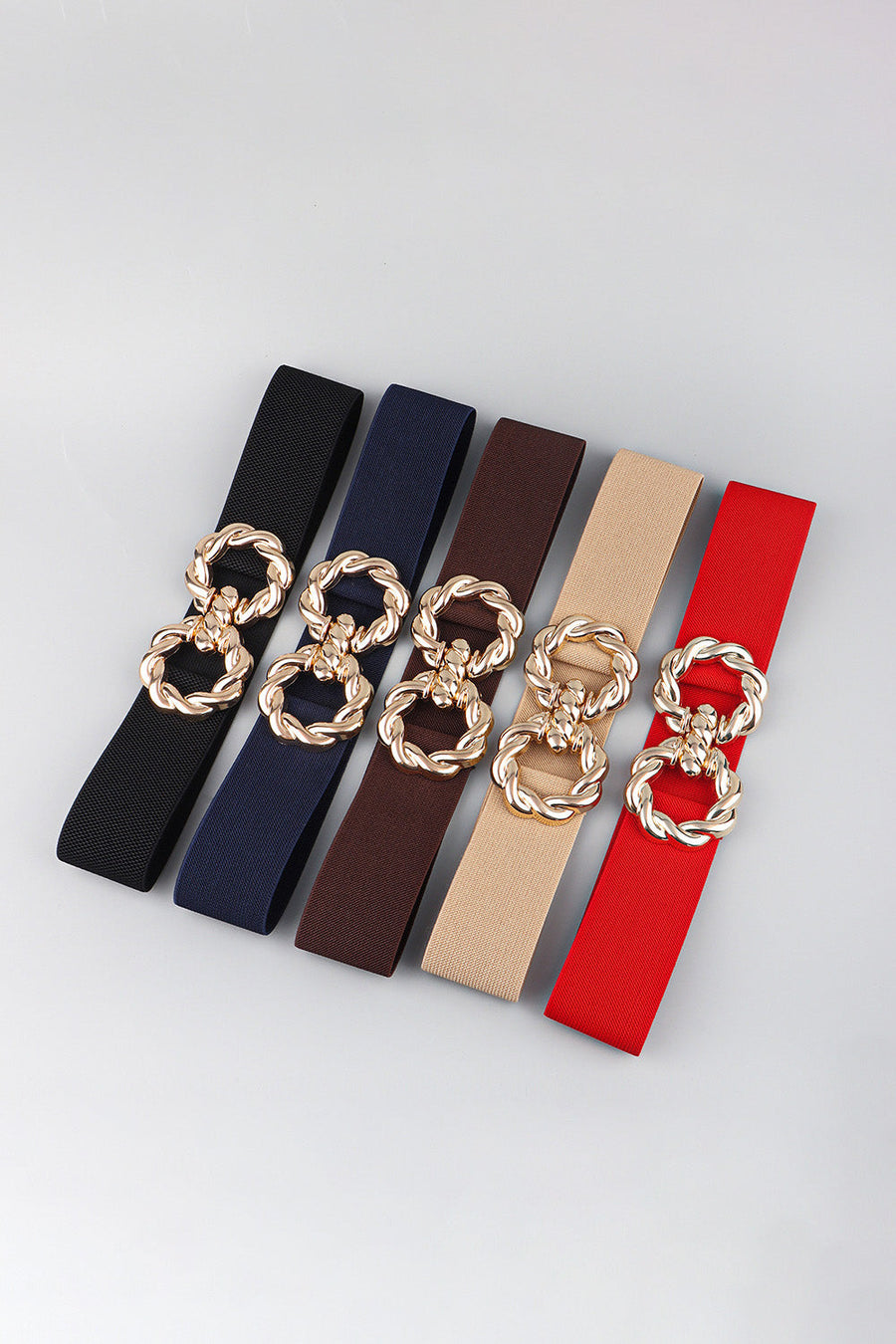 Braided stretch belts in black, dark blue, chocolate, tan, and red with gold alloy buckle detail.