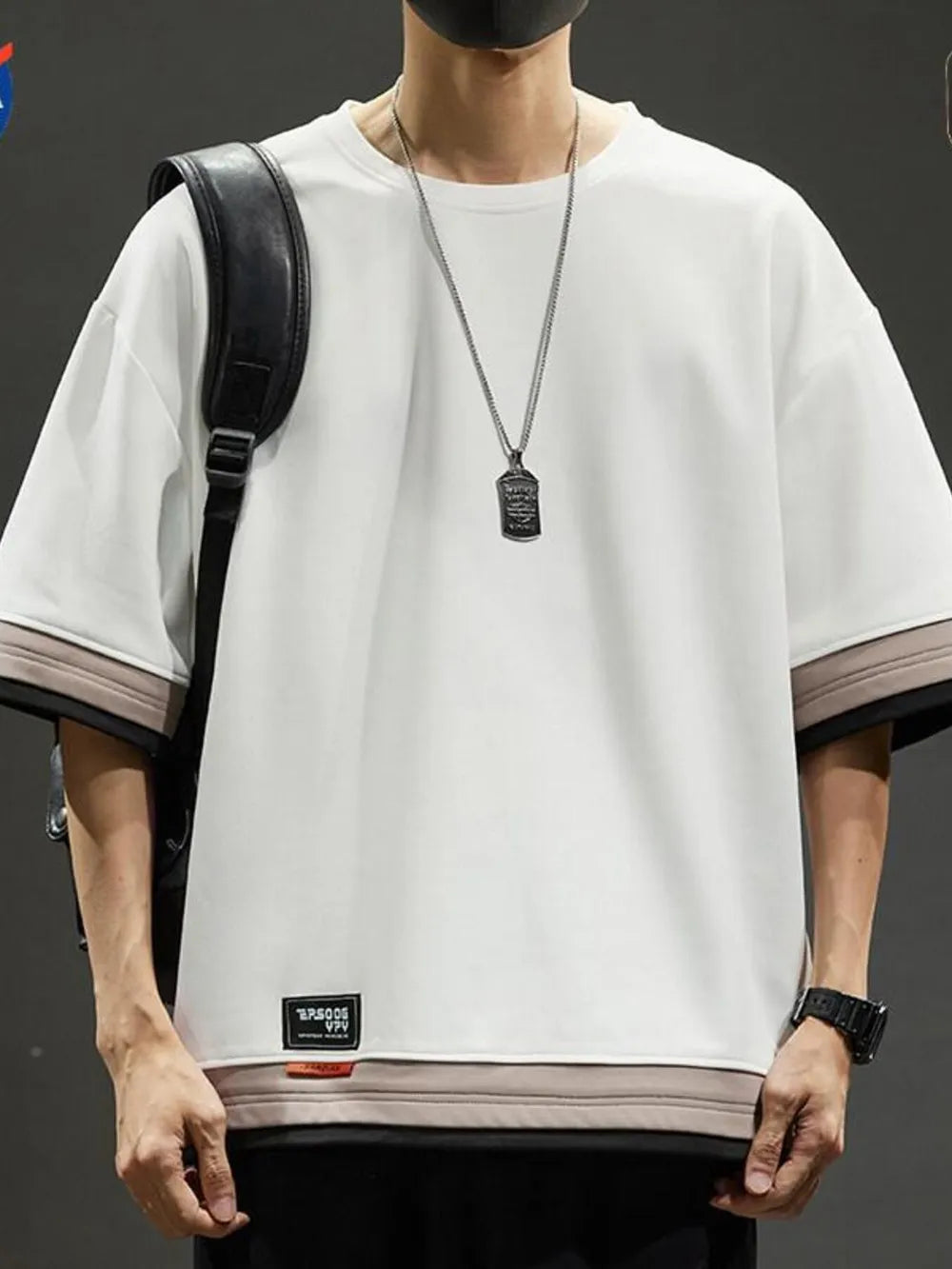 Men's white cotton blend t-shirt with contrast stitching and loose fit.
