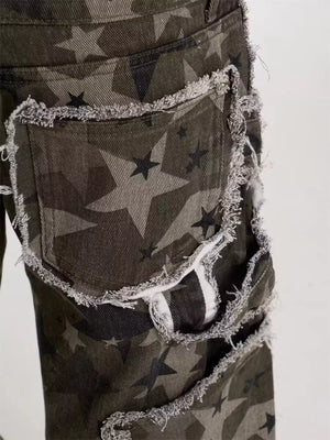 Star-embellished distressed wide-leg jeans in camouflage print with frayed edges.