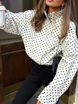 black zip-up jacket featuring collared and polka dot