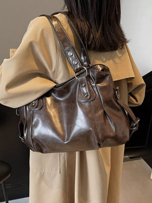 Large brown vintage PU leather shoulder bag with silver hardware details.