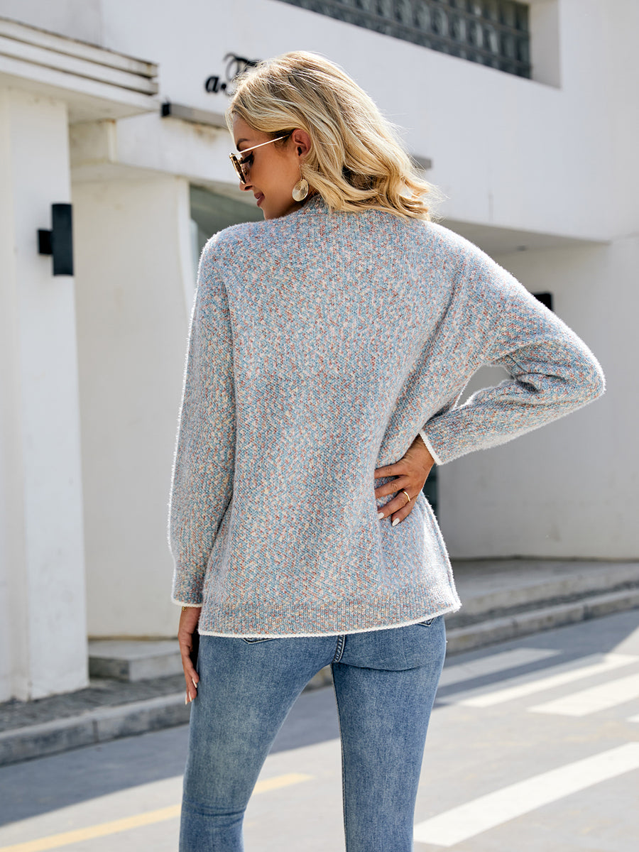 Light gray textured knit cardigan with contrast trim and buttoned front.
