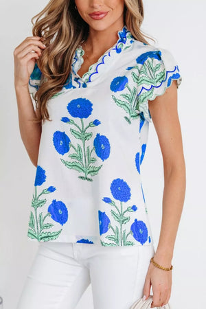 Blue floral print cotton blouse with scalloped neckline and sleeves