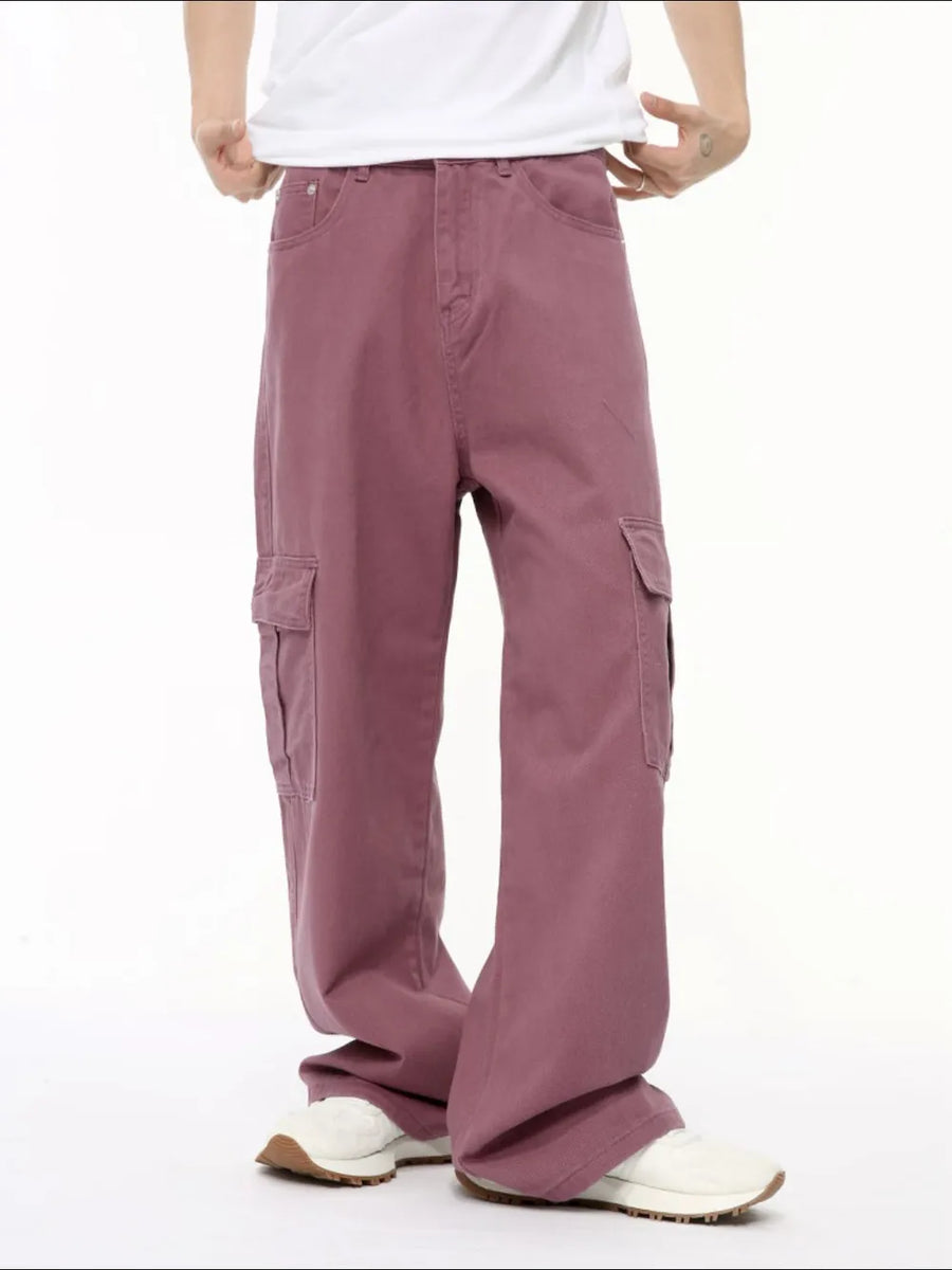 Oversized cargo denim trousers in dusty pink with multiple pockets and a relaxed fit.