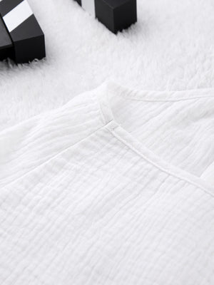 White cotton cami pajama top with textured fabric and V-neck detail