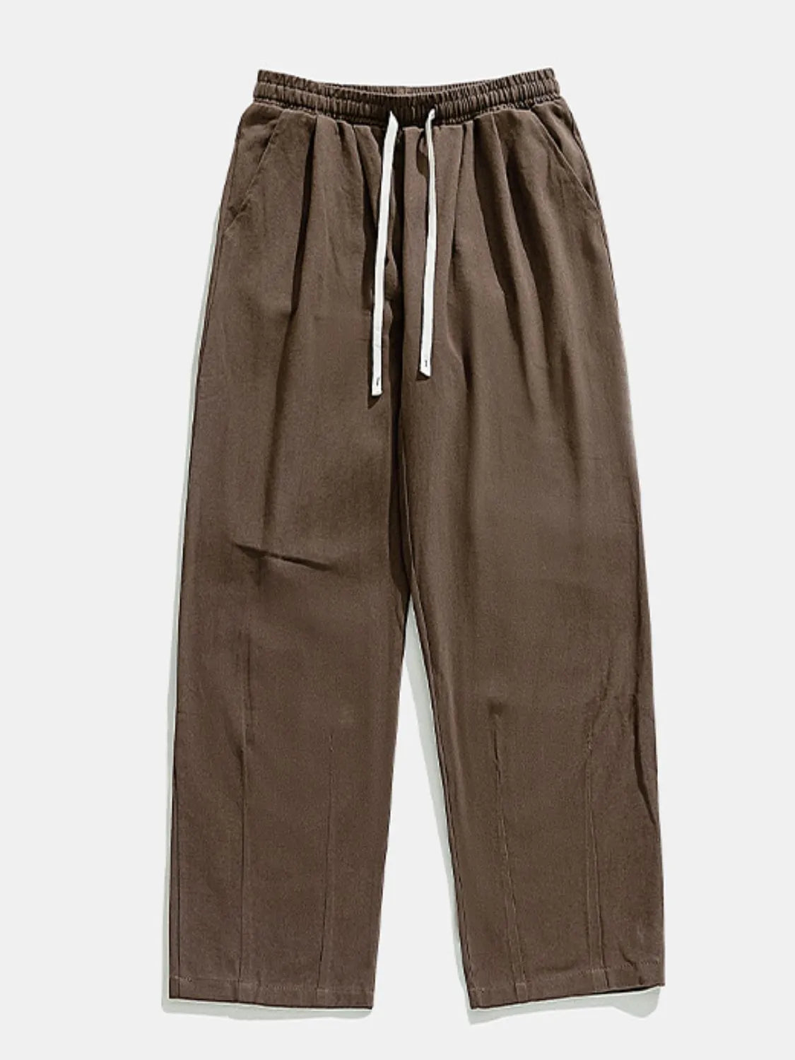Wide-leg pleated trousers in coffee brown with drawstring waist and pockets.