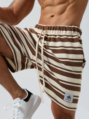 Brown and cream striped textured jogger shorts with drawstring and logo patch.