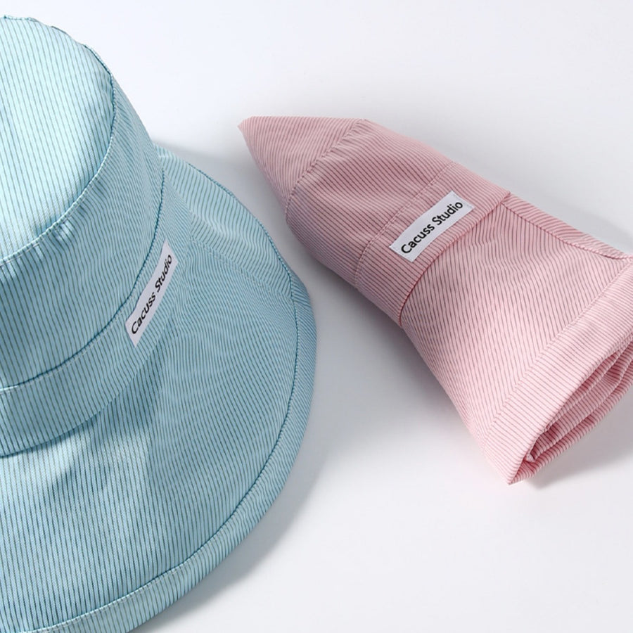 Premium wide brim sun hat in pink and mint green with pinstripe pattern.